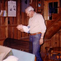Dad holds baby Scott one hand cottage