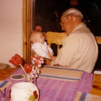 Dad talks to baby cottage