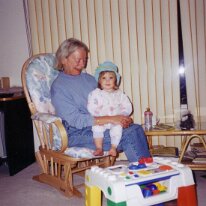 Mum sits with baby Meaghan