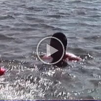 Caitlin swimming and pontoon boat